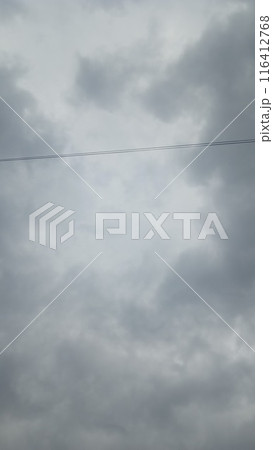 Grumpy mood cloudy sky and electric cable background 116412768