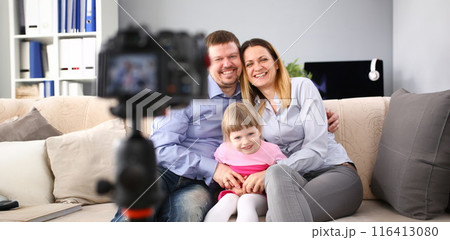 Young happy family sit on couch making photo session portrait 116413080
