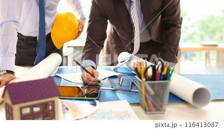 Architect Engineer Team Work on Building Draft Architect Engineer Team Work on Building Draft 116413087