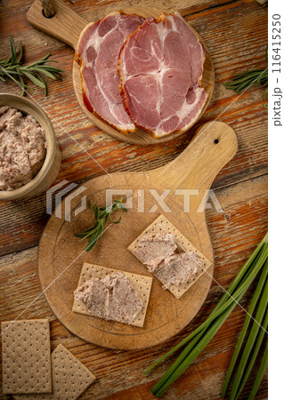 Two crackers topped with savory ham pate 116415250