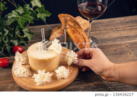 Woman hand taking slice of cheese 116416227