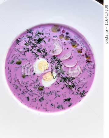 Cold pink beetroot soup with cucumber, boiled egg, dill and yogurt in white bowl lithuanian Cold pink beetroot soup with cucumber, boiled egg, dill and yogurt in white bowl lithuanian 116417339