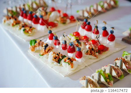 Buffet. Various canapes on banquet trays. Catering services. 116417472