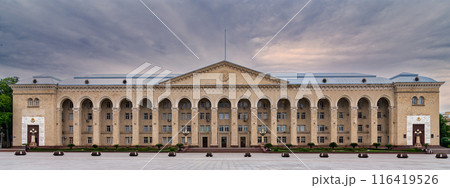 Wide shot of Ganja City Hall, Azerbaijan, a large beige building with arched facade, many windows, central entrance 116419526