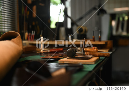 Leather craft work tools on the workbench. Small business and handmade concept 116420160