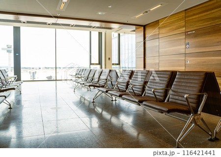 Airport lounge with spacious seating near windows, relax for travelers Airport lounge with spacious seating near windows, relax for travelers 116421441
