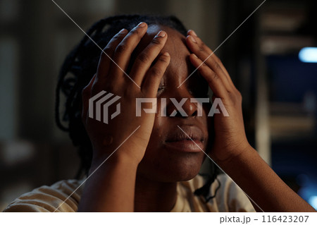 Woman touching face by hands and crying Woman touching face by hands and crying 116423207