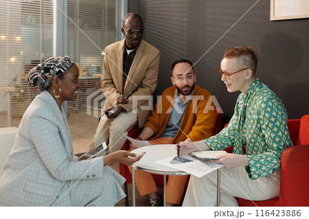 Diverse Team Collaborating on Business Project in Office 116423886