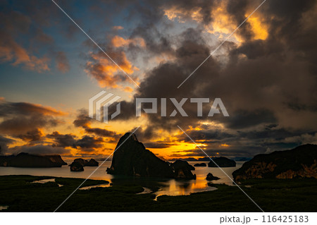 Landscape Long exposure of majestic clouds in the sky sunset or sunrise over sea with reflection in the tropical sea.Beautiful cloudscape scenery.Amazing light of nature Landscape nature background 116425183