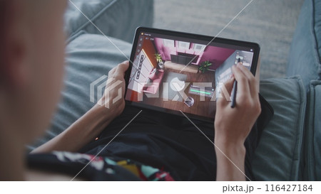 Creative teenage designer draws design for project 116427184