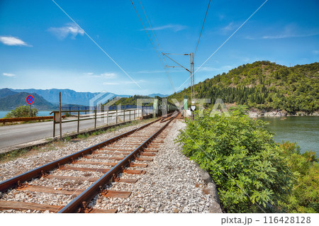 Captivating view of Skadar lake surrounded by green mountain peaks on a sunny day. Captivating view of Skadar lake surrounded by green mountain peaks on a sunny day. 116428128