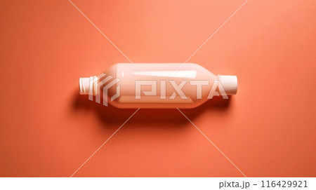 Mockup of a pink plastic bottle resting on a pastel surface 116429921