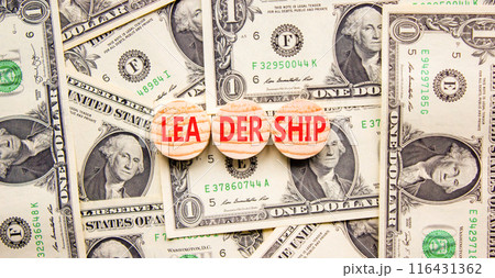Leadership symbol. Concept word Leadership on beautiful wooden circles. Dollar bills. Beautiful background from dollar bills. Business leadership concept. Copy space. 116431362