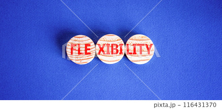 Flexibility symbol. Concept word Flexibility on beautiful wooden circles. Beautiful blue background. Business flexibility concept. Copy space. Flexibility symbol. Concept word Flexibility on beautiful wooden circles. Beautiful blue background. Business flexibility concept. Copy space. 116431370