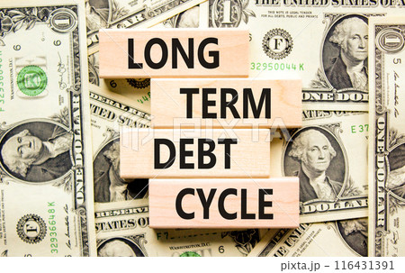 Long term debt cycle symbol. Concept words Long term debt cycle on beautiful wooden block. Beautiful dollar bills background. Dollar bills. Business Long term debt cycle concept. Copy space 116431391