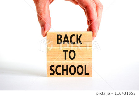 Back to school and support symbol. Concept words Back to school on wooden blocks. Businessman hand. Beautiful white table white background. Business, educational Back to school concept. Copy space. 116431655