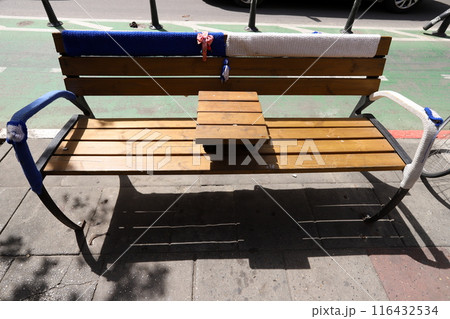 Rest bench in a city park in Israel. 116432534