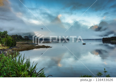 Milford Sound or Rahotu with Mitre peak in foggy on the lake at New Zealand Milford Sound or Rahotu with Mitre peak in foggy on the lake at New Zealand 116433026