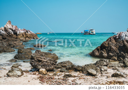 Tropical turquoise sea with reef rock on the beach in sunny day 116433035