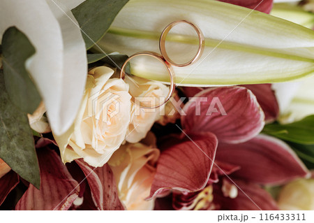 A bouquet of flowers with a mix of red and white flowers A bouquet of flowers with a mix of red and white flowers 116433311