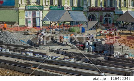 Workers with protective mask welding reinforcement for tram tracks in the city timelapse 116433342