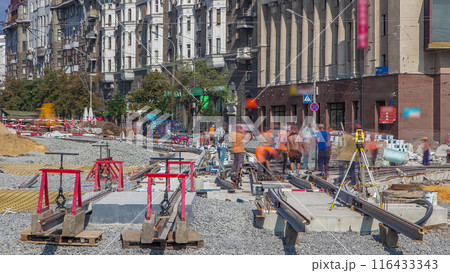 Tram rails at the stage of their installation and integration into concrete plates on the road timelapse Tram rails at the stage of their installation and integration into concrete plates on the road timelapse 116433343
