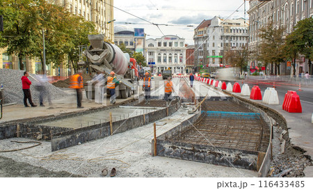 Concrete works for road maintenance construction with many workers and mixer machine timelapse Concrete works for road maintenance construction with many workers and mixer machine timelapse 116433485