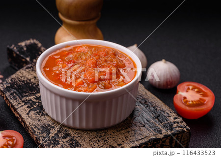 Red hot or spicy sauce with chili peppers, tomatoes, garlic, spices 116433523