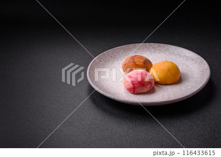 Delicious colorful asian mochi sweets with rice dough shell Delicious colorful asian mochi sweets with rice dough shell 116433615
