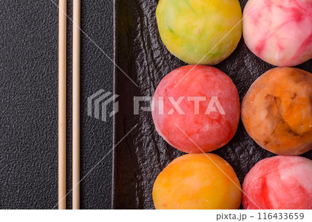 Delicious colorful asian mochi sweets with rice dough shell 116433659