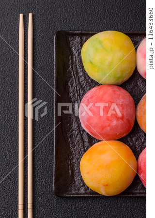 Delicious colorful asian mochi sweets with rice dough shell Delicious colorful asian mochi sweets with rice dough shell 116433660