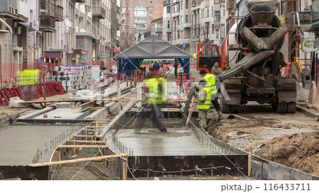 Concrete works for road maintenance construction site with many workers and mixer timelapse Concrete works for road maintenance construction site with many workers and mixer timelapse 116433711