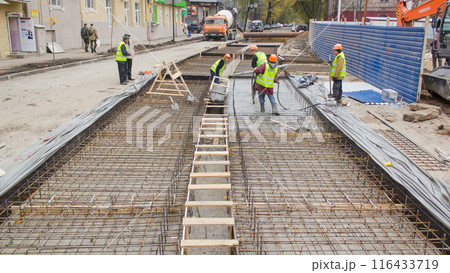 Concrete works for road maintenance construction site with many workers and mixer timelapse Concrete works for road maintenance construction site with many workers and mixer timelapse 116433719