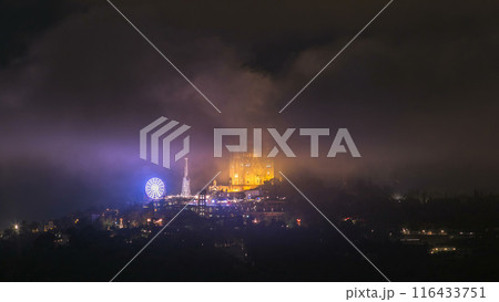 Temple of the Sacred Heart of Jesus timelapse on Tibidabo Mountain in Barcelona in clouds, Catalonia, Spain 116433751