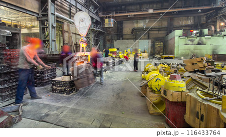 The liquid metal is poured into molds at the metallurgical plant timelapse hyperlapse. The liquid metal is poured into molds at the metallurgical plant timelapse hyperlapse. 116433764