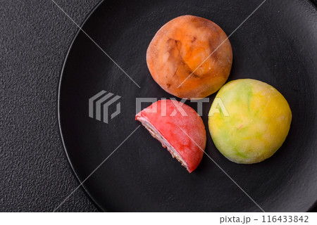 Delicious colorful asian mochi sweets with rice dough shell Delicious colorful asian mochi sweets with rice dough shell 116433842
