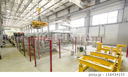 The operator lifting device timelapse, lift loads using lifting magnet, mechanical workshop, metal structures plant. The operator lifting device timelapse, lift loads using lifting magnet, mechanical workshop, metal structures plant. 116434155