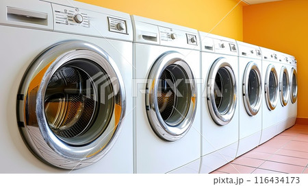 A snapshot of modern convenience - these washing machines, resplendent in their metallic glory, wait patiently for their next load, promising cleanliness and freshness 116434173