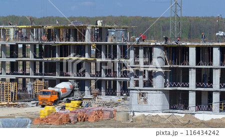 Large construction site with buildings under construction and multi-storey residential homes timelapse. Large construction site with buildings under construction and multi-storey residential homes timelapse. 116434242