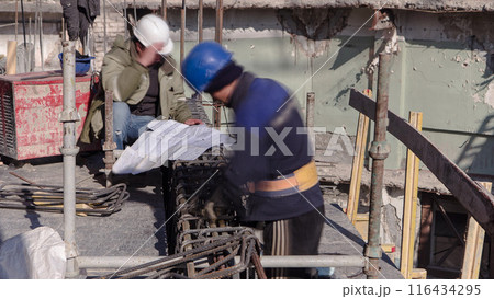 Steel bar rebar metal framework reinforcement for concrete at construction site timelapse. 116434295