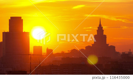 Moscow. Stalin skyscraper on the background of a large the sunset sun timelapse, Russia Moscow. Stalin skyscraper on the background of a large the sunset sun timelapse, Russia 116435000