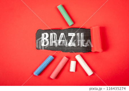 BRAZIL. Text under torn red paper on a blackboard BRAZIL. Text under torn red paper on a blackboard 116435274