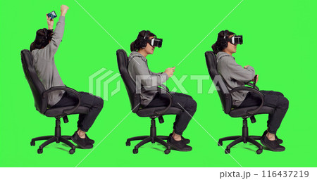 In studio, asian adult enjoys phone game with vr headgear, participating in online roleplaying with mobile software on glasses. Young guy gamer enjoying good time with virtual reality. In studio, asian adult enjoys phone game with vr headgear, participating in online roleplaying with mobile software on glasses. Young guy gamer enjoying good time with virtual reality. 116437219