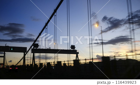 Silhouette of transportation bridge with cars, road at sunset of transportation bridge with cars, road at sunset 116439923