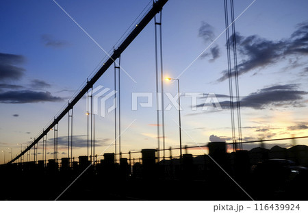 Silhouette of transportation bridge with cars, road at sunset of transportation bridge with cars, road at sunset 116439924
