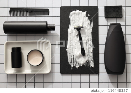 Men's shaving tools and cosmetics bottles on light background, top view Men's shaving tools and cosmetics bottles on light background, top view 116440327