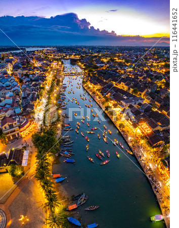 Aerial view of Hoi An Ancient Town with lantern boats on Hoai river, in Hoi An, Vietnam 116441652