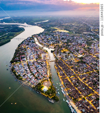 Aerial view of Hoi An Ancient Town with lantern boats on Hoai river, in Hoi An, Vietnam Aerial view of Hoi An Ancient Town with lantern boats on Hoai river, in Hoi An, Vietnam 116441665