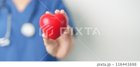 Doctor hand holding red heart shape in hospital. love, donor, world heart day, world health day, CSR donation and Insurance concepts Doctor hand holding red heart shape in hospital. love, donor, world heart day, world health day, CSR donation and Insurance concepts 116441698