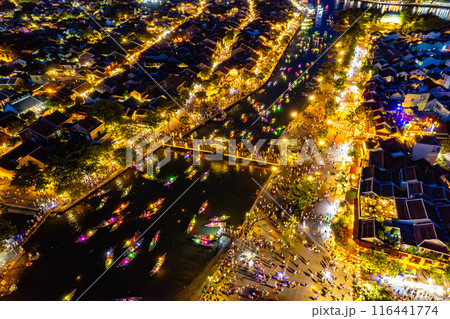 Aerial view of Hoi An Ancient Town with lantern boats on Hoai river, in Hoi An, Vietnam 116441774